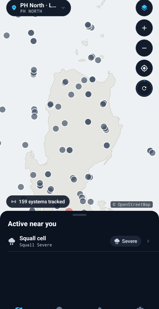 TyphoonGuard app showing tracked storms and an active squall-cell alert across the northern Philippines